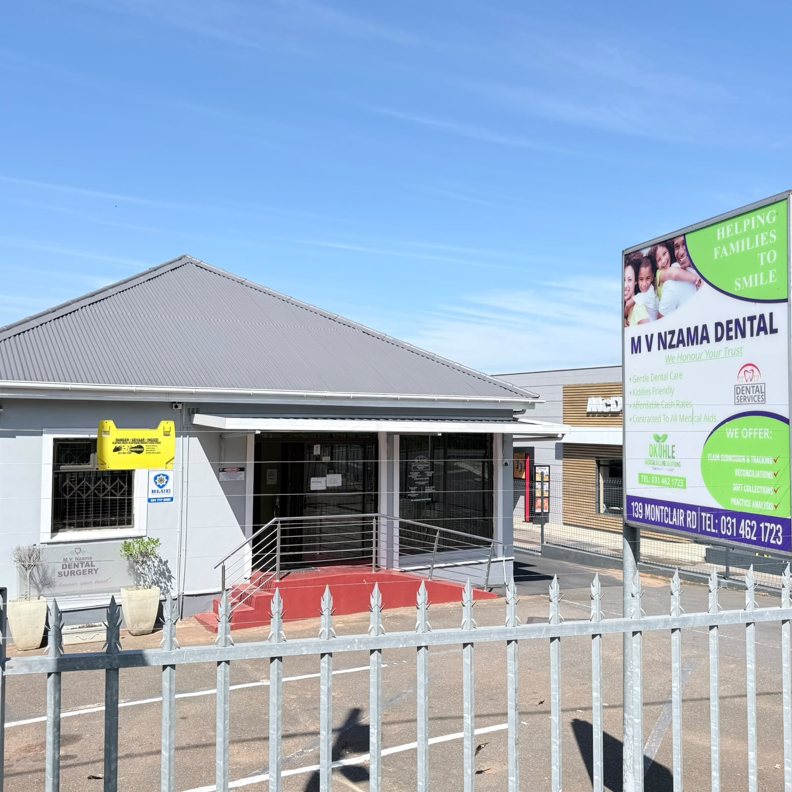 MV Nzama Dental in Montclair, with its sign, safe parking and a ramp to the front door